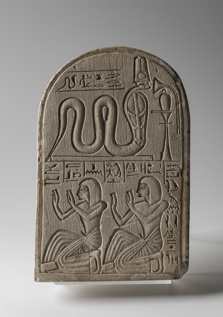 Stele Dedicated by Pendua to MeretsegerThe ‘Servant in the Place of Truth’, Pendua, and Shedsuani, in the pose of worshiping the cobra-goddess Meretseger 'She who loves Silence’. New Kingdom, 19th Dynasty, ca. 1292-1189 BC. Limestone, from Deir...