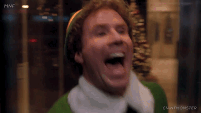 buddy the elf excitedly running through a revolving door on repeat