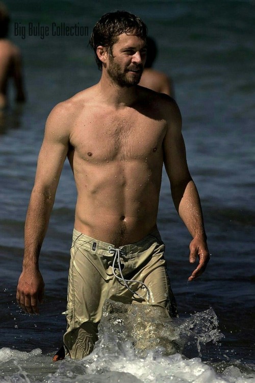 Paul Walker makes a splash on the beach by giving us a peak at...