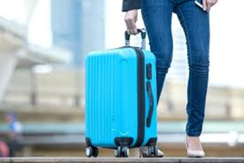 women carrying blue luggage bag 