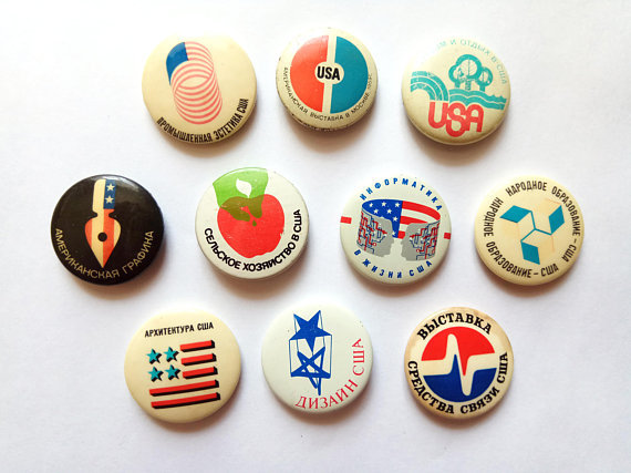 A small collection of 10 Soviet buttons with an USA theme.
Buttons read things like “Photography in USA”, “Research in USA”, “USA design” etc. These pins were produced to accompany themed exhibitions that were held in the USSR during the perestroika...