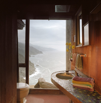 skidmoreowingsmerrill:<br />An Architect’s Home<br />The warm refuge of this California home stands in stark contrast to its rugged surroundings in the Carmel Highlands. In the autumn of 1952, Nathaniel Owings, a founding partner of SOM, scrambled up a stretch of the Big Sur coastline with Margaret Wentworth. They found respite on an idyllic slice of land, where they picnicked and resolved to make the place their home after they married. A year later, they returned to build “Wild Bird” on this very perch out of concrete and reclaimed redwood. As Owings later said in an interview with Time magazine, “No house can do more than snuggle into and grab hold of and hold on to a sheer bit of granite on this coast.” Working with architect Mark Mills, they set the A-frame structure into the cliffside and surrounded it with cantilevered balconies to take in the Big Sur landscape. Owings, who was born on this day in 1903, would spend much of his life in the coastal residence. As he told the magazine, “This is a onetime house for the rest of the time we expect to be here on earth.”<br />Photos © Richard Waite<br /> skidmoreowingsmerrill:<br />An Architect’s Home<br />The warm refuge of this California home stands in stark contrast to its rugged surroundings in the Carmel Highlands. In the autumn of 1952, Nathaniel Owings, a founding partner of SOM, scrambled up a stretch of the Big Sur coastline with Margaret Wentworth. They found respite on an idyllic slice of land, where they picnicked and resolved to make the place their home after they married. A year later, they returned to build “Wild Bird” on this very perch out of concrete and reclaimed redwood. As Owings later said in an interview with Time magazine, “No house can do more than snuggle into and grab hold of and hold on to a sheer bit of granite on this coast.” Working with architect Mark Mills, they set the A-frame structure into the cliffside and surrounded it with cantilevered balconies to take in the Big Sur landscape. Owings, who was born on this day in 1903, would spend much of his life in the coastal residence. As he told the magazine, “This is a onetime house for the rest of the time we expect to be here on earth.”<br />Photos © Richard Waite<br />