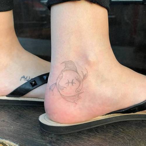 By Joey Hill, done at High Seas Tattoo Parlor, Los Angeles.... small;zodiac symbol;single needle;symbols;pisces symbol;line art;tiny;joeyhill;ankle;ifttt;little;astrology;pisces;fine line;zodiac