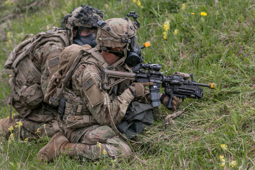 Soldiers and vehicles with the Ukrainian 14th Mechanized...