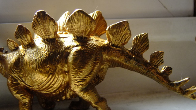 brass dinosaur figurine