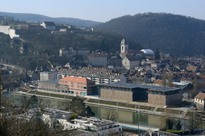 archatlas:<br /><br /><br /><br />Besançon Art Center and Cité de la Musique Kengo Kuma  Associates<br /><br />From the architect:Located in the eastern part of France, Besancon is also known as the city where Seiji Ozawa won the first prize at the International Competition of Orchestra Conductors (1959). Situated in the center of the city along the banks of the Doubs River, this multipurpose cultural facility is part of the FRAC project in France to stimulate cultural activity in regional areas, and features a music hall, contemporary art museum and conservatory (music school).The brick-clad warehouse that was built in the 1930s was converted into a museum. This structure, as well as the newly built music hall and conservatory are covered with a large green roof to tie them all together. Voids are provided between the respective boxes, and this space is covered by a green roof with a mosaic of plants and solar panels that allows soft light to come through.Images and text via <br /><br /> Kengo Kuma  Associates<br /><br />