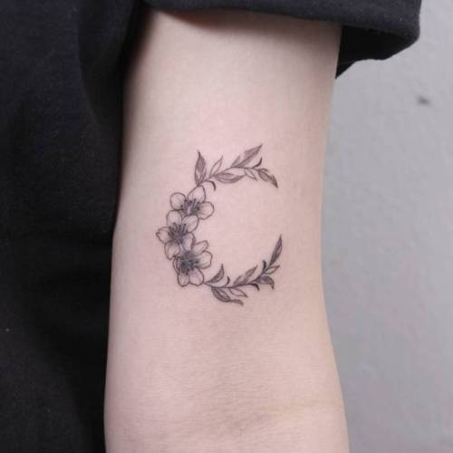 By Hyoa tattooer, done in Seoul. http://ttoo.co/p/35672 flower;small;cherry blossom;single needle;spring;tiny;ifttt;little;hyoa;nature;crescent moon;moon;four season;illustrative;fine line;astronomy;bicep;line art