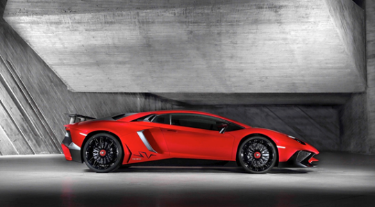 Red 2016 Lamborghini Aventador sitting in garage