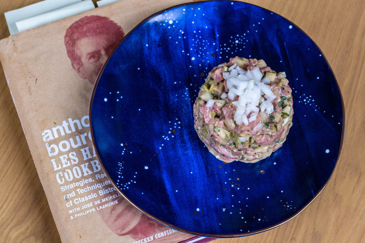 The Les Halles steak tartare with cookbook underneath