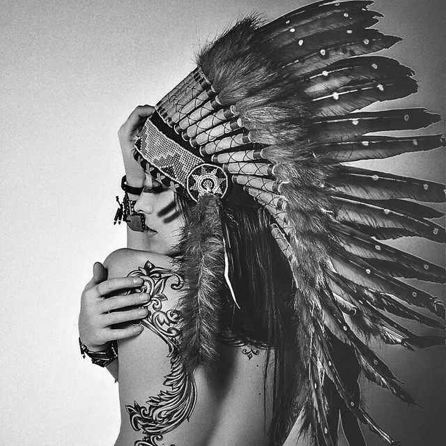 Girl with indian headdress and back tattoo. ... - I wonder.. a lot...