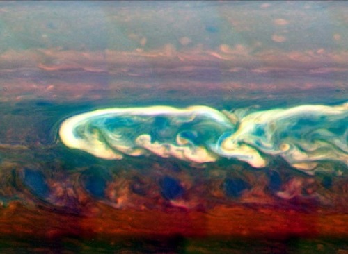 astronomyblog:Saturn’s atmosphere exhibits a banded pattern...