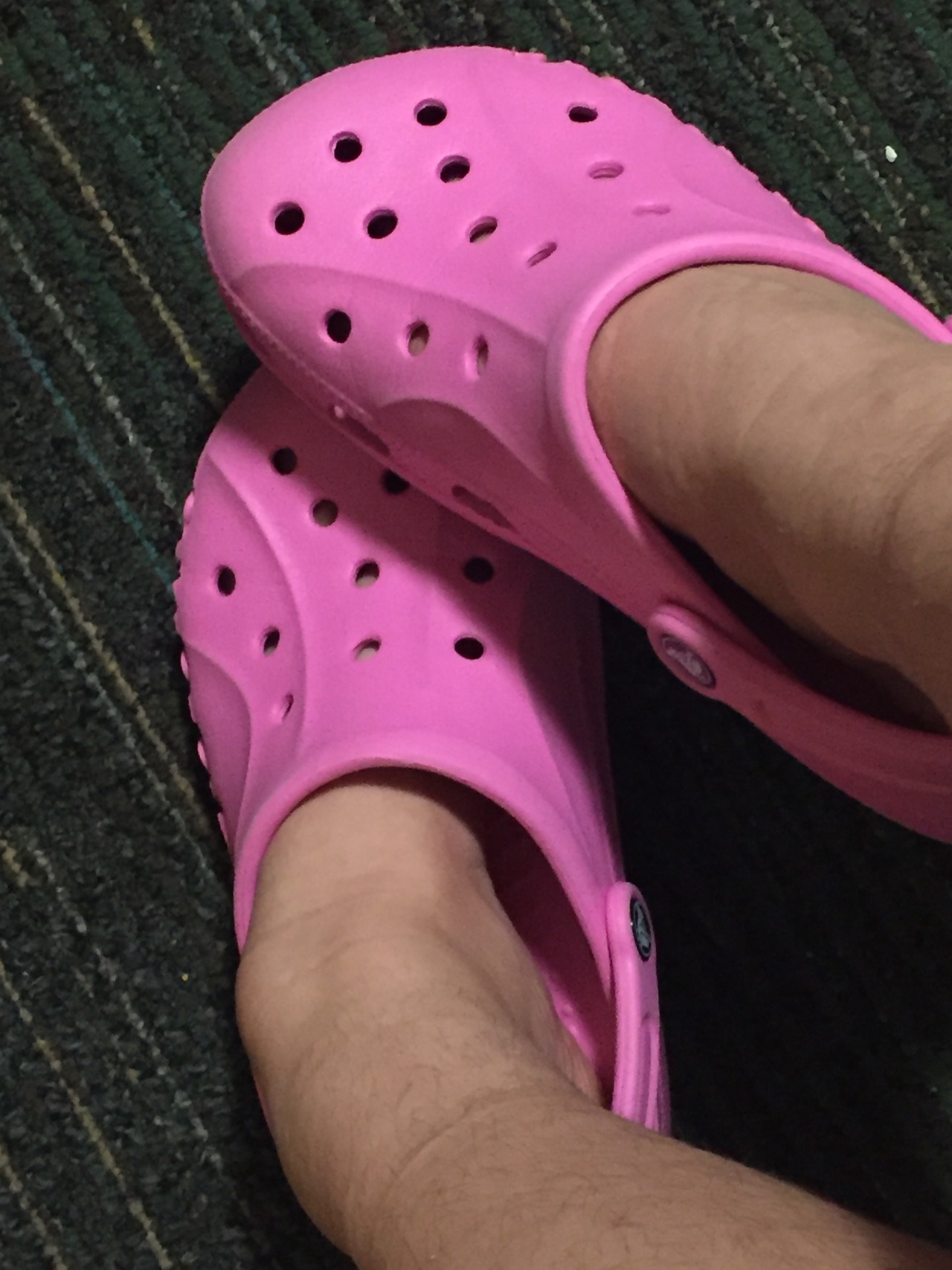 crocs with feet painted on them