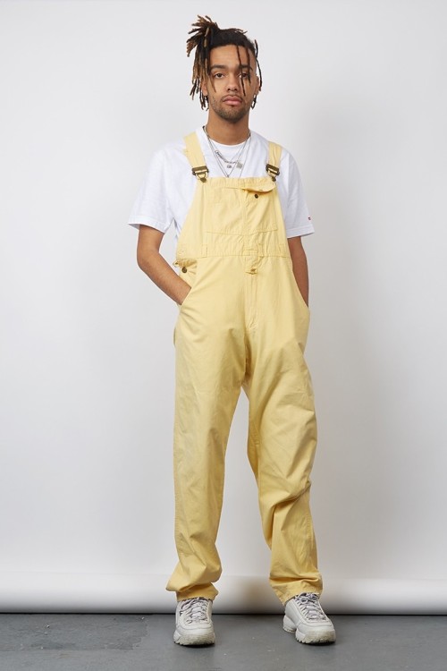 yellow baggy overalls
