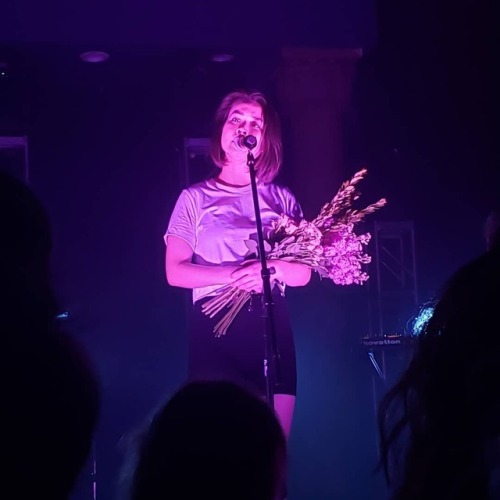 officialmitski:Mitski threw flowers out to the audience at the...