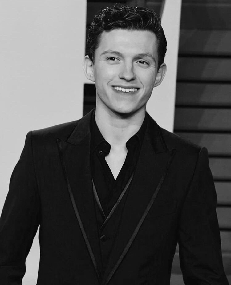 tom holland invented smiling while wearing a suit.