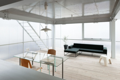 ombuarchitecture:<br /><br />House in Tousuien<br />Hiroshima • Japan<br />By Suppose Design Office<br />The House of Tousuien is located in a quiet residential area, and it is designed for a couple and 3 children. The three sides of this house are surrounded by other residence buildings, and the shape of the site forces the house to stay long and narrow.<br />Most exterior walls are thick and heavy, where windows are added to balance out the heavy look of the exterior. For the House of Tousuien, we used a thin and translucent material to replace the regular exterior walls, where natural light and be maximized in the interior space.<br />via Archdaily<br />