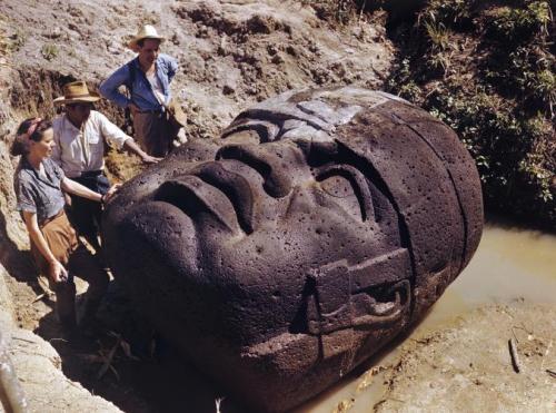 monolithzine:A photograph of archaeologists studying an Olmec...