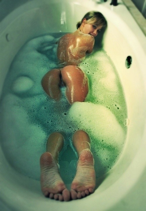 Teen taking a bubble bath