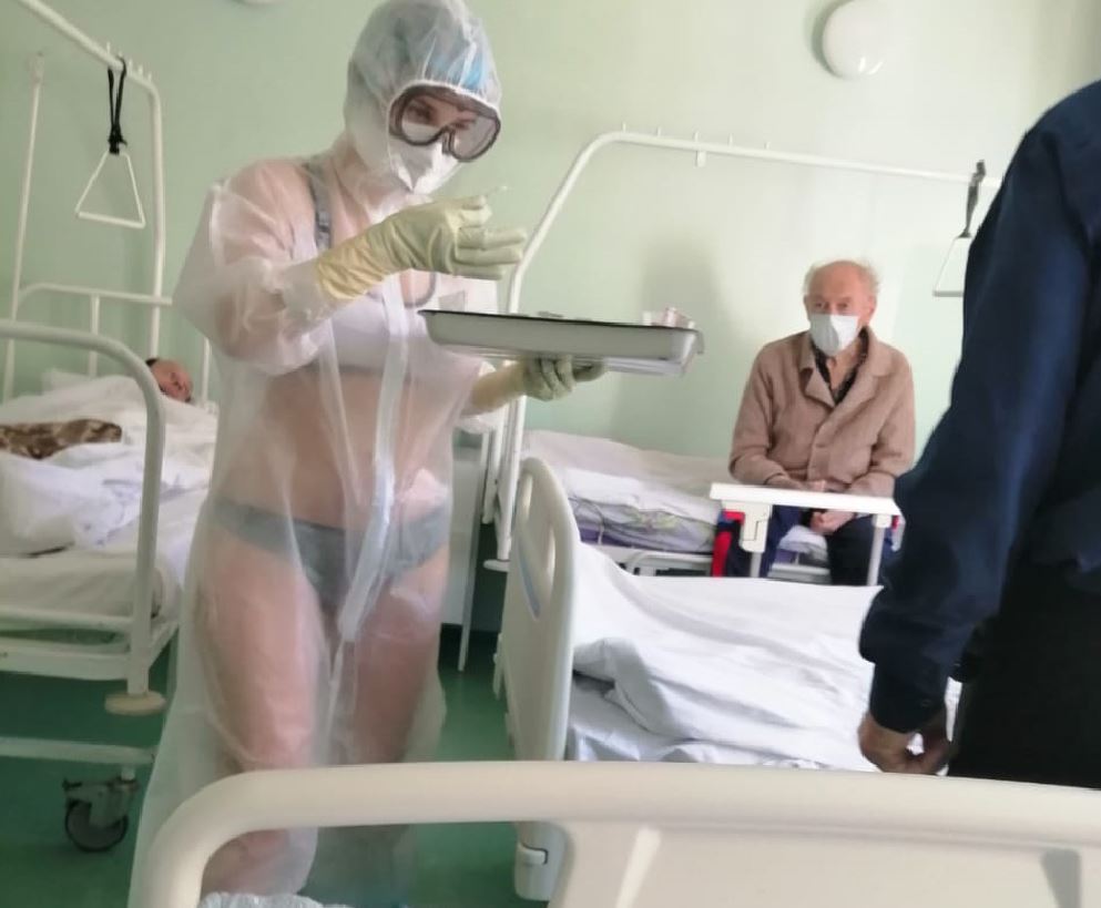A nurse from Tula, Russia wearing a swimsuit under a protective suit. (Reason: it’s too hot in the PPE).