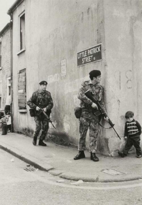 historicaltimes:A little boy walking to his friends encounters...