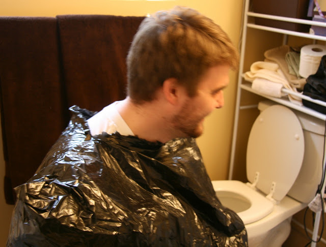 trash bag haircuts - wearing garbage bags for home haircuts