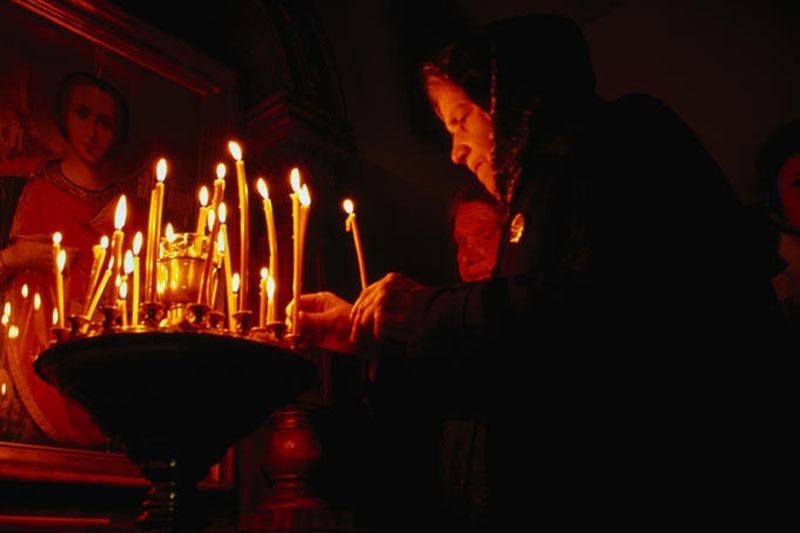 Minsk: A Largest City in Belarus with Its Beautiful Panorama: Much lighting candle are illuminating the room of Russian Orthodox church