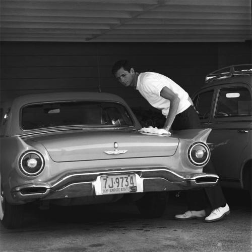 vintageeveryday:Anthony Perkins cleaning his 1957 Ford...