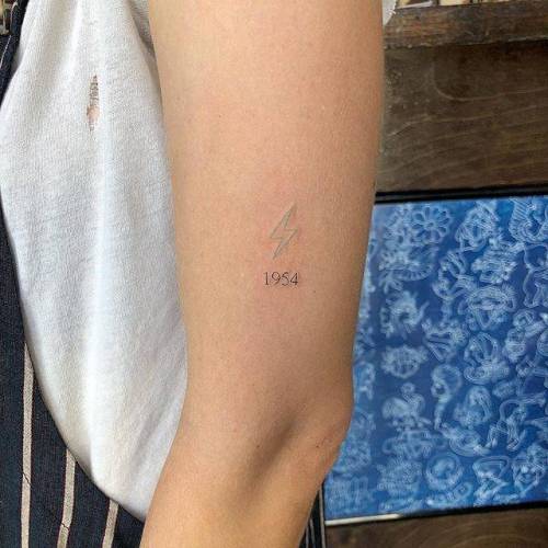 By Joey Hill, done at High Seas Tattoo Parlor, Los Angeles.... small;birth year;micro;tiny;date;joeyhill;ifttt;little;nature;lightning bolt;minimalist;other;upper arm;number;fine line;mathematical;line art