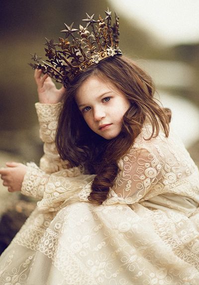 â€œ `But how can it have got there without my knowing it?â€™ she said to herself, as she lifted it off, and set it on her lap to make out what it could possibly be.
It was a golden crown. `Well, this is grand!â€™ said Alice. `I never expected I should be a...