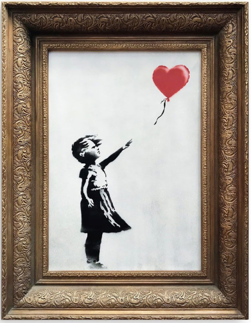 #banksy painting self-destructs after fetching $1.4 million at...