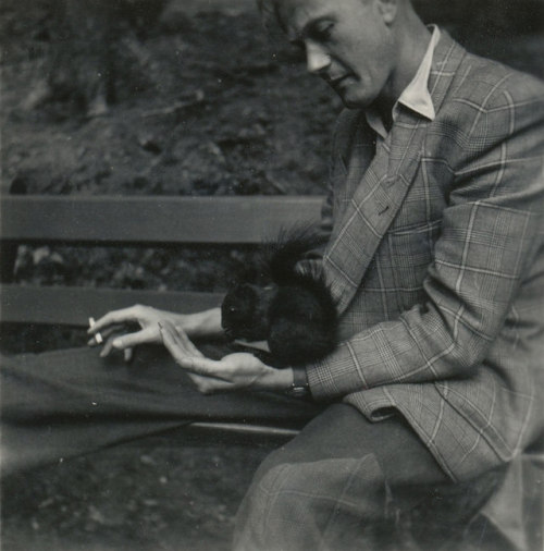 vintageeveryday:Smokingman with his squirrel friend in the...