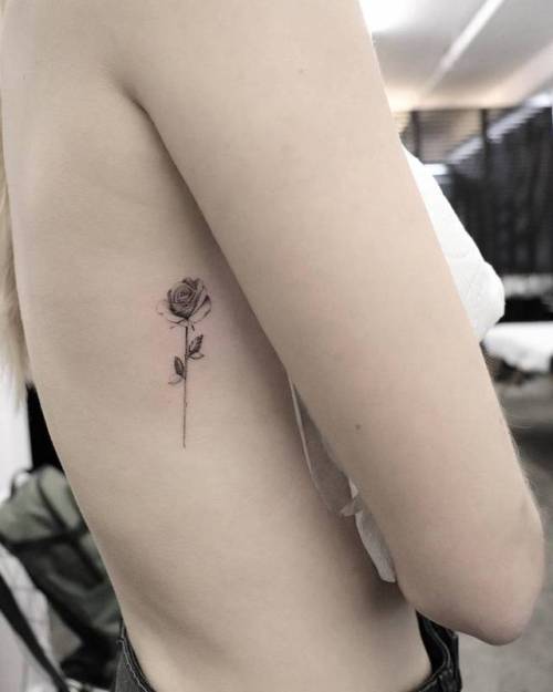 By Michelle Santana, done at Bang Bang Tattoo, Manhattan.... flower;small;single needle;rib;tiny;rose;ifttt;little;nature;michellesantana
