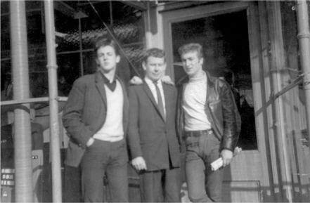 Paul McCartney & John Lennon with Bob Wooler. 1961.