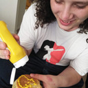 blog logo of my avi is me putting mustard on burger while high