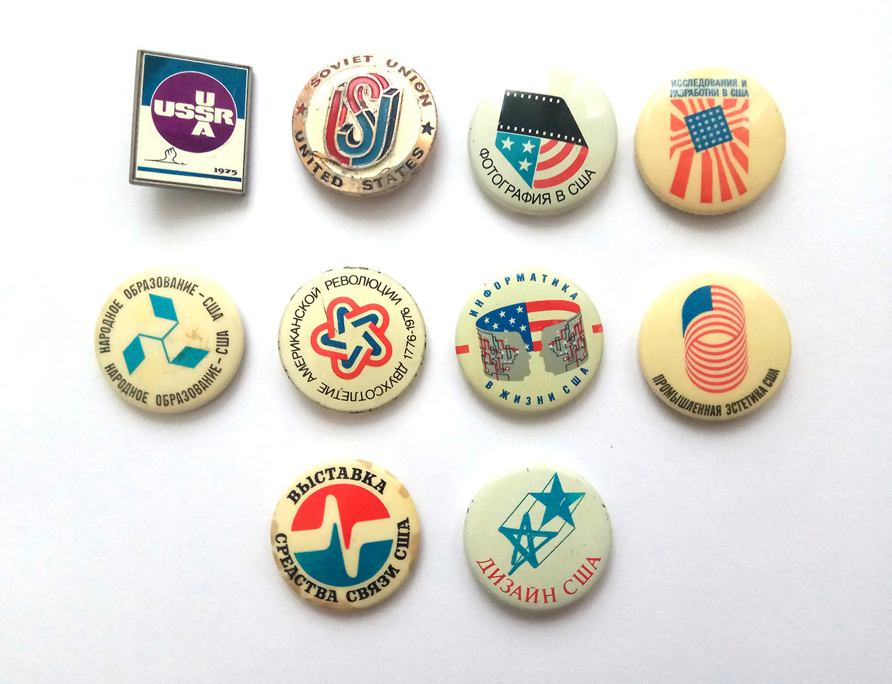 A small collection of Soviet pins and buttons with a USA theme. Includes 8 buttons and 2 pins. (buy)