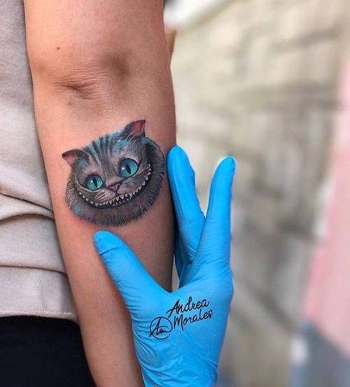 By Andrea Morales, done at La Mala Vida Tattoo Parlour, Madrid.... small;andreamorales;tiny;disney;alice in wonderland characters;ifttt;little;forearm;medium size;cat;alice in wonderland;illustrative;film and book;disney character;cartoon character;feline;fictional character;cheshire cat;animal