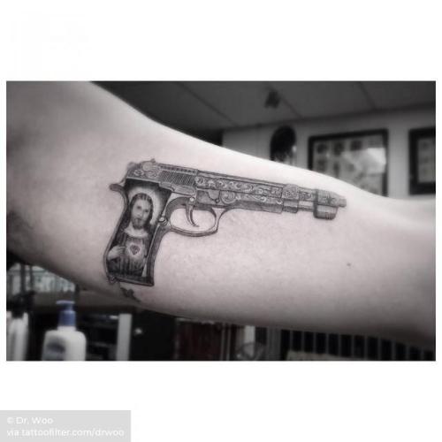 G Dragon | By Dr. Woo, done at Shamrock Social Club, West... film and book;g dragon;single needle;inner arm;celebrity;facebook;twitter;romeo and juliet;singers;drwoo;medium size;gun;weapon
