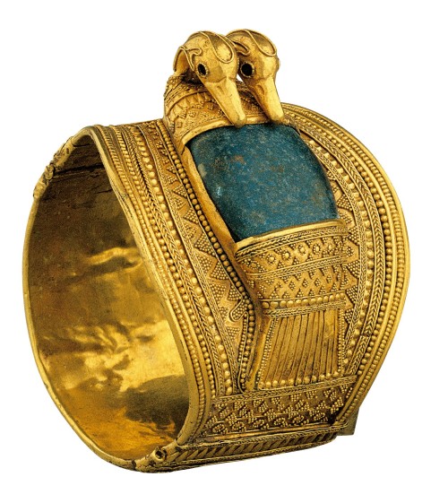 Bracelet of Ramesses IIThe solid gold bangle is composed of two parts, linked on one side by a hinge and on the other by a clasp. The broader upper part of the bracelet is decorated with a double-headed duck. Its body consist of a large chunk of...