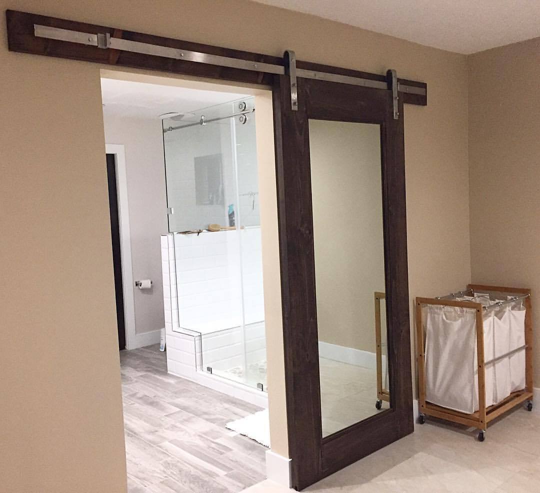 Carved Woodworks — Barn door with a built full length mirror.