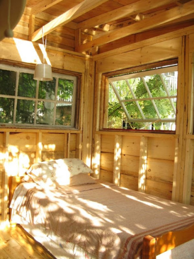 tenaciouslytinyhouses:<br /><br />Windows can really open up a space, but also give your house the unique character of whatever landscape you choose to live upon. Who would say no to dappled light and trees? <br />Relax Shax is a wonderful source that usually has articles to expound upon its images: http://relaxshax.wordpress.com/<br /><br />Love the windows! 