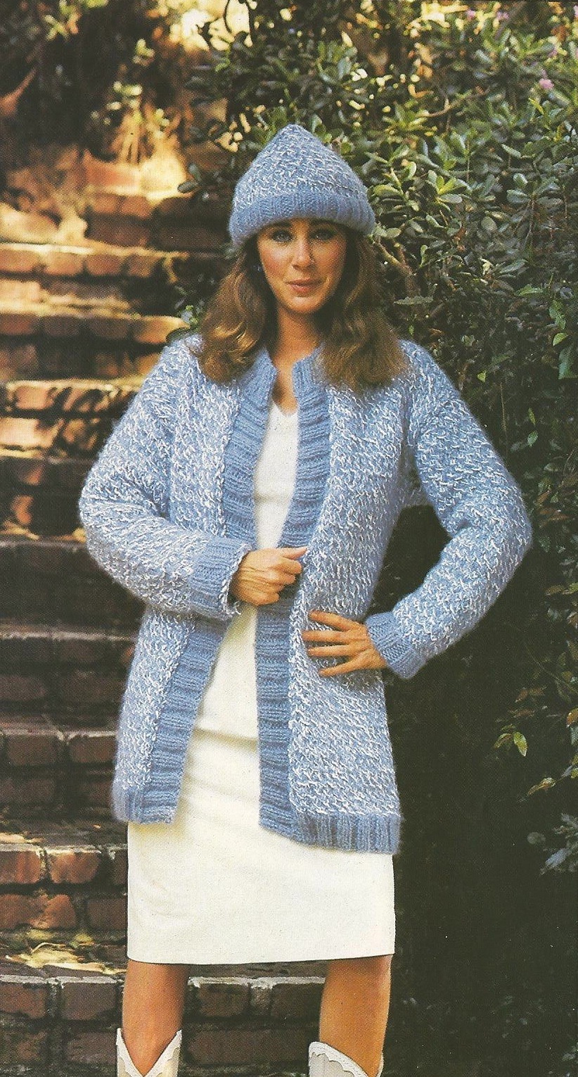 Pamela Bellwood modeling sweaters for a knitting...