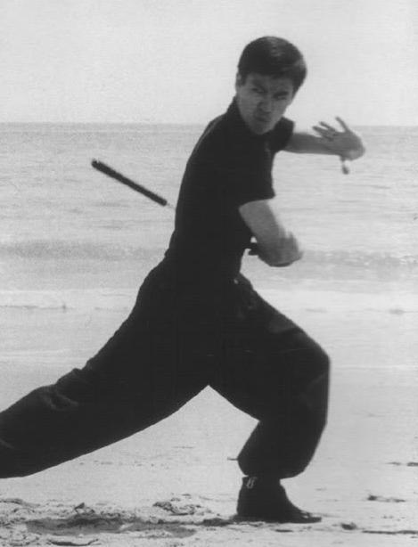 gutsanduppercuts:A young Bruce Lee practicing on the beach...