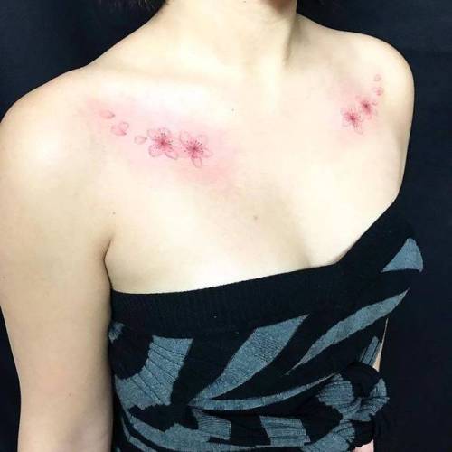 By Jing, done at Jing’s Tattoo, Queens.... flower;jing;small;individual matching;matching;cherry blossom;collarbone;spring;tiny;ifttt;little;nature;four season;illustrative