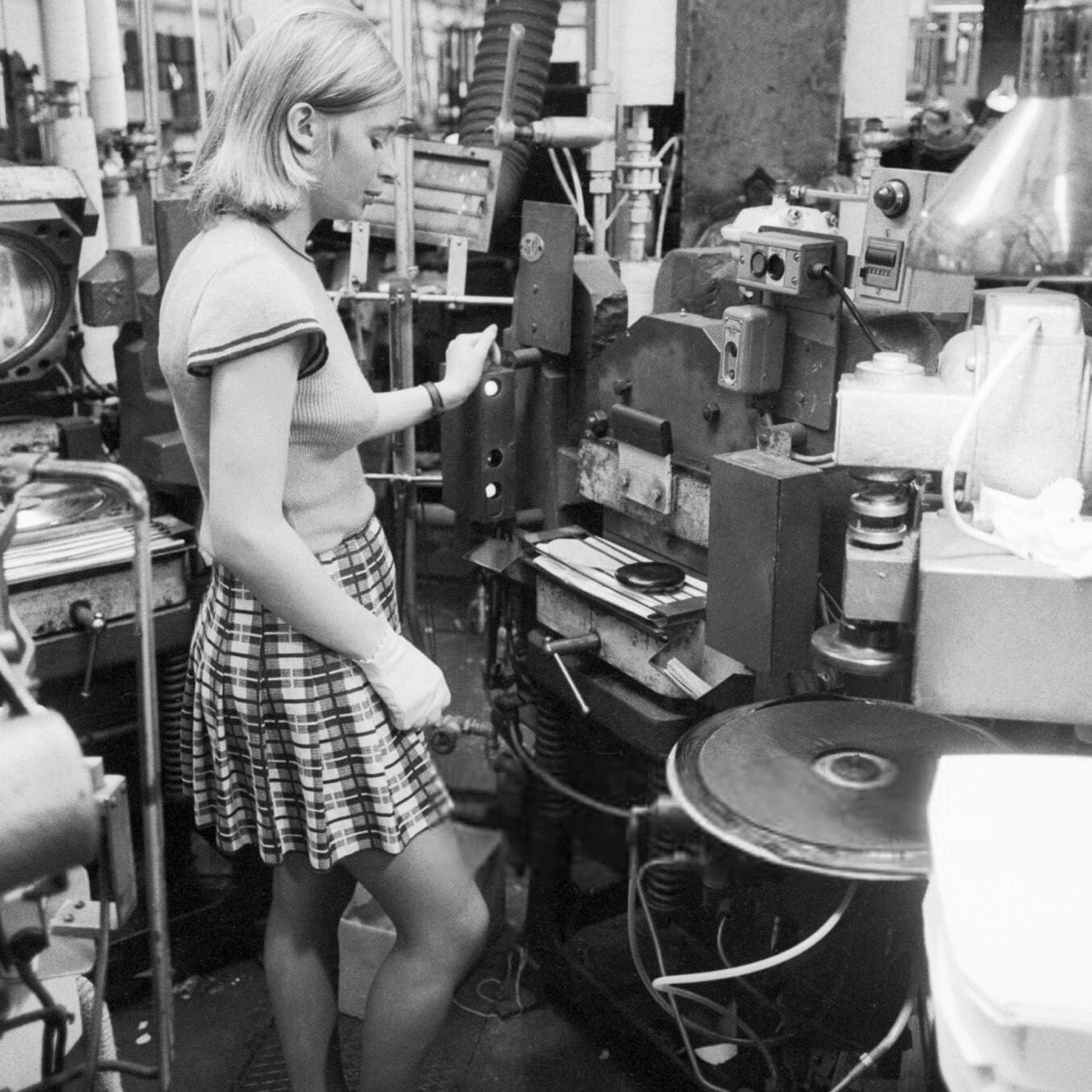 Super Seventies — An employee checks the quality of a vinyl record...