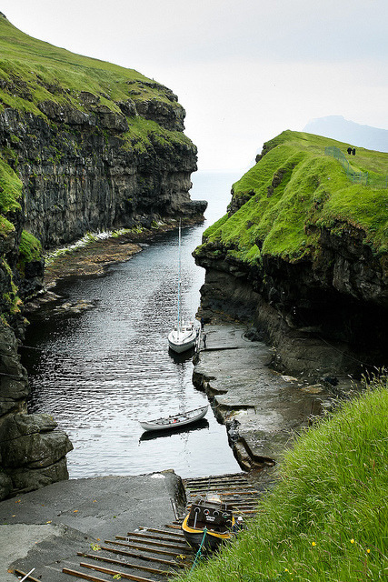 sub-25:A small bay allows boats to dock in Eysturoy, Faroe...