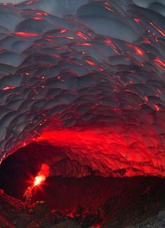 sixpenceee:Inside an ice cave underneath volcano. This is...