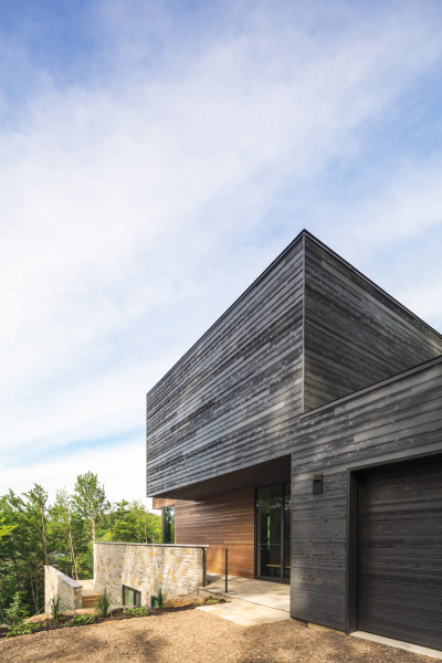 archatlas:<br /><br /><br />Estrade Residence in Quebec<br /><br /><br />Located in the verdant Laurentians in Quebec, the Estrade Residence reveals itself discretely on the shores of Lac de la Cabane in St-Adolphe d’Howard. It is by studying the steep and rocky topography of the place that MU Architecture decided to highlight the peculiarities of this site with an adapted and captivating architectural intervention. <br />Follow the Source Link for images sources and more information. <br />