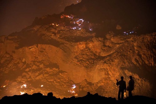 “THE EARTH IS ON FIRE”In Jharia, India, the...