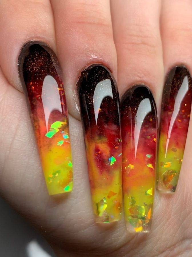 sassy nails, nails and spa, glitter nails, tina nails, essie ballet slippers Sculpted Coffin Nails | Marbled Black, Red, Orange, and Yellow | Encapsulated Yellow/Orange Mylar, Brown Glitter, and Opal Gel. . . Look at that shine valentinobeautypure topcoat. Peep the speckles in the red too y. . . your next Full Set, Fill, or Pedi service at pampernailgallery.com Now open in Fremont, California!. Click nowselect a service, and tap my name to book an appointment with me. DM me  if you have any questions . . Tags: , getpamper , pampernailgallery , nails , oaklandnails , sanjosenails , sfnails , bayareanails , bayareanailtech , sculptednails , nailforms , acrylicnails , clearnails , nails , nailsonpoint , nailporn , blacknails , glitternails , longnails , coffinnails , ombrenails , rainbownails , rednails , orangenails , yellownails , lavanails , firenails , nailart , naildesigns , fallnails , marblenails , mylarnails 