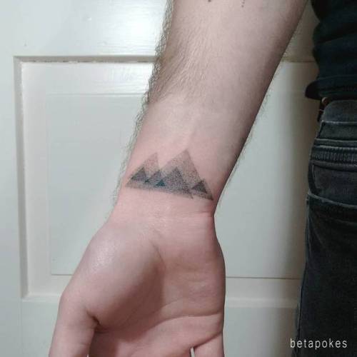 By Beta Pokes, done in Berlin. http://ttoo.co/p/31918 small;abstract;dotwork;betapokes;egyptian pyramids;tiny;africa;hand poked;ifttt;little;giza;location;blackwork;wrist;egypt;patriotic